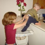 child safety picture of child climbing on counter